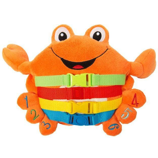 Plush orange crab toy with smiling face, colorful buckles across its belly, and numbers embroidered on each claw and leg.