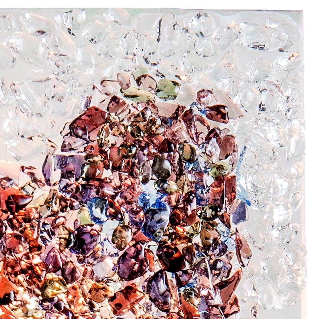 A fused glass heart night light with iridescent multicolor chips, perfect for unique gifts.