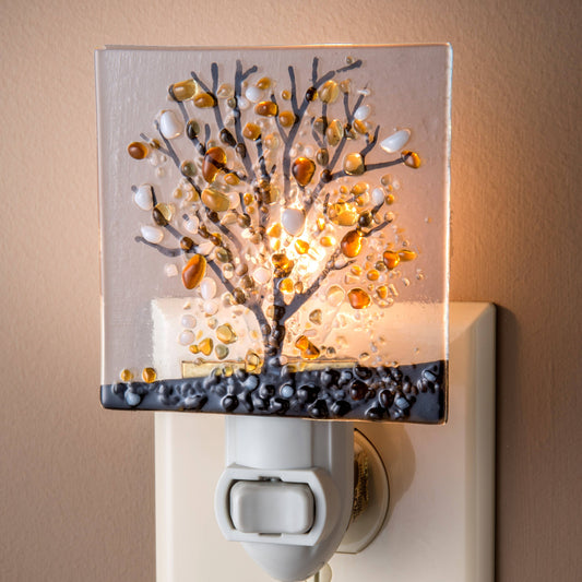 Fused glass night light featuring a vibrant fall tree design with warm autumn colors and intricate details.
