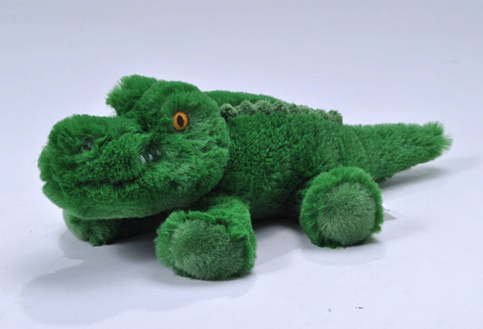Small green alligator plush toy with soft fur and round paws