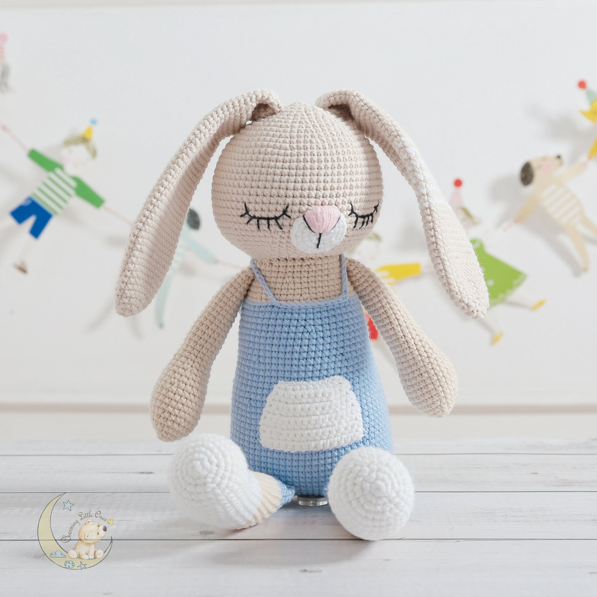 Handmade crochet bunny, 21 inches tall, with soft beige fur, long ears, and a blue dress with white accents.