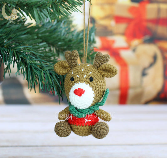 "Adorable handmade reindeer Christmas ornament with handmade details, wearing a red nose and festive scarf."