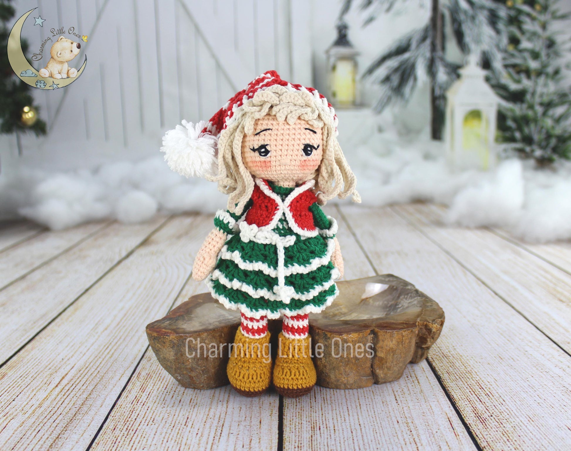 A handmade crochet Christmas doll with a red and green striped dress, white hat, and yellow boots.