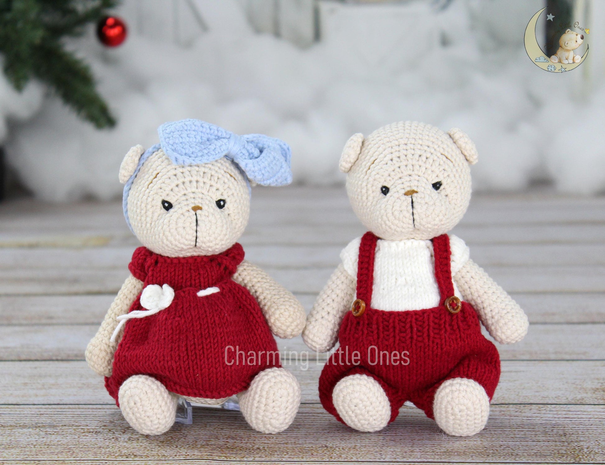 Handmade crochet Christmas bears in red outfits, one with a blue bow.